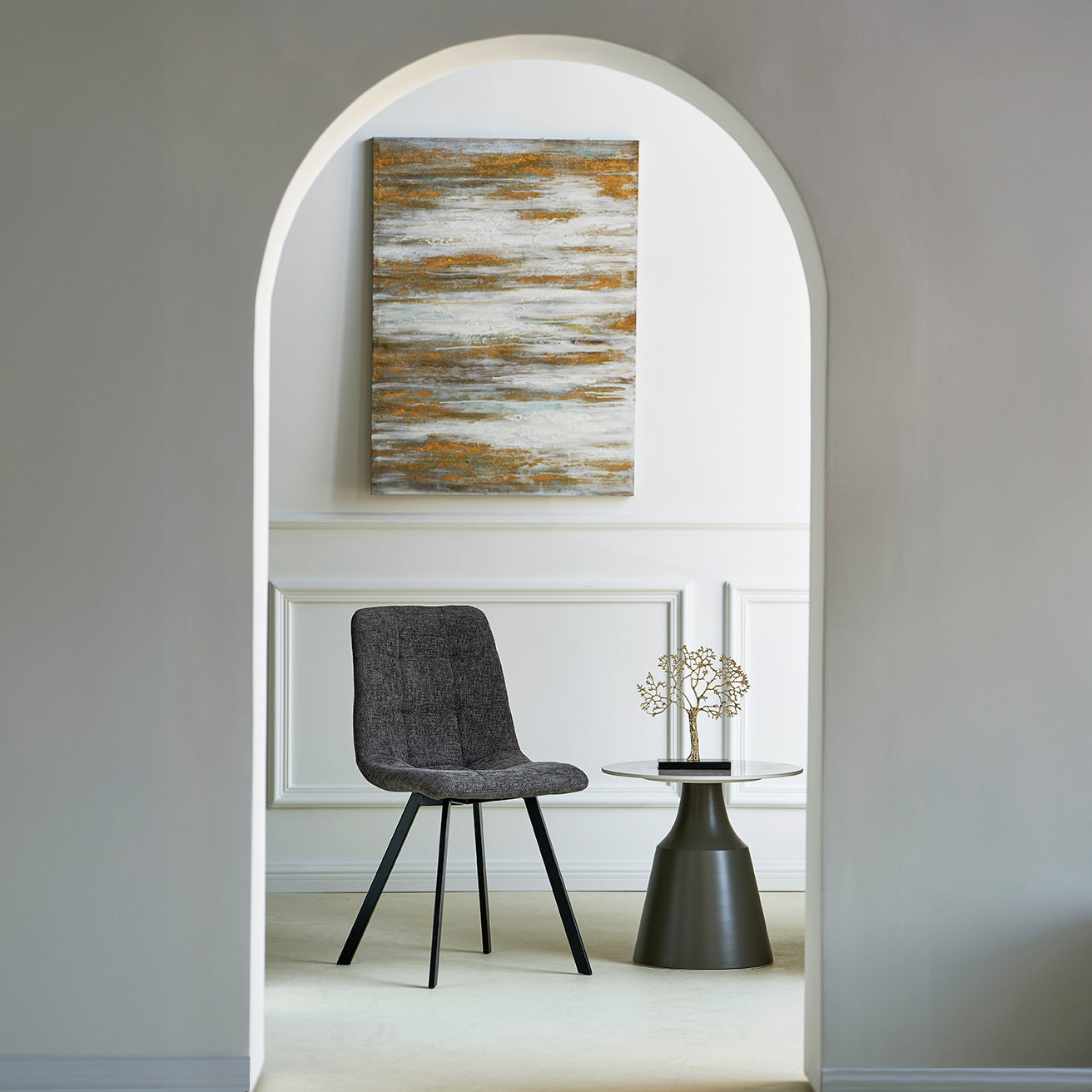 Set of four Aoife upholstered dining chairs around a contemporary table in a stylish dining room setting