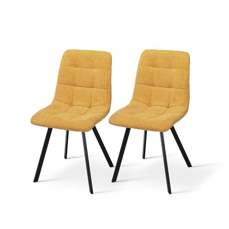 Black powder-coated metal legs on Aoife dining chairs providing stable support with scratch-resistant floor protectors
